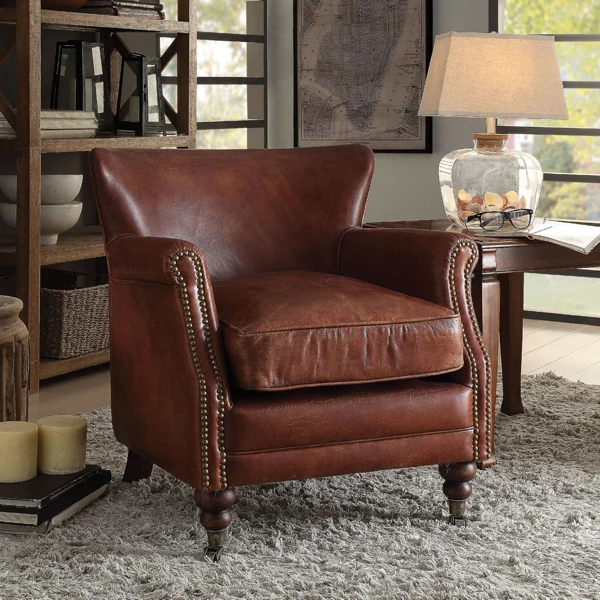 Brown leather club chair with brass nailheads