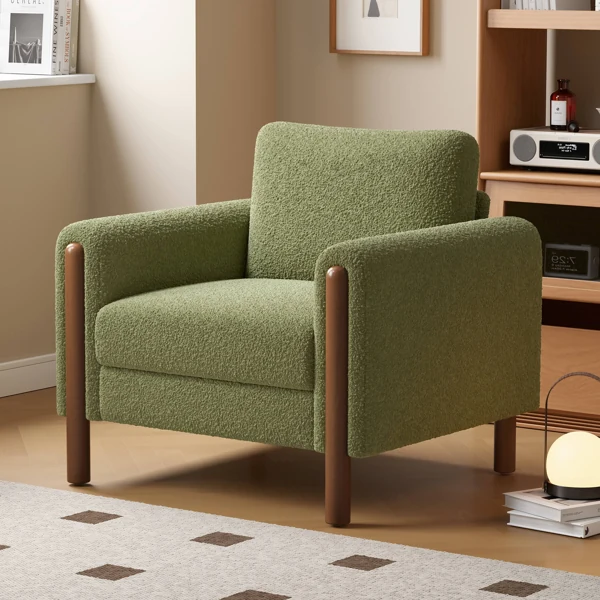 Green bouclé armchair with wooden cylindrical legs