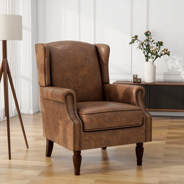 High-back brown leather wingback armchair