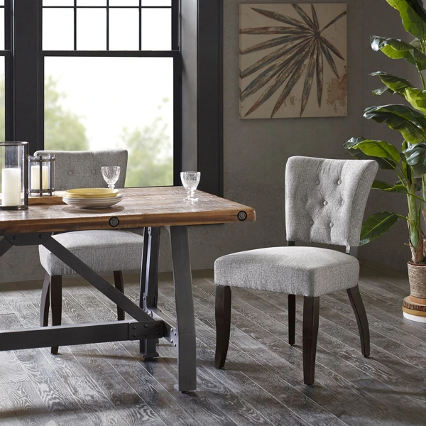 Industrial wood table with tufted grey chair