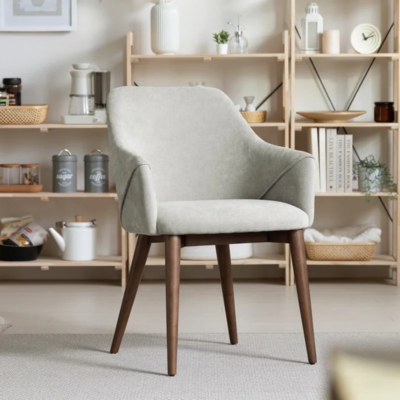 Light gray bucket-style dining chair with wood legs