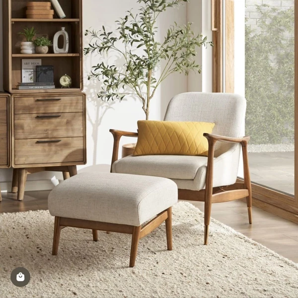 Mid-century lounge chair and ottoman with yellow pillow