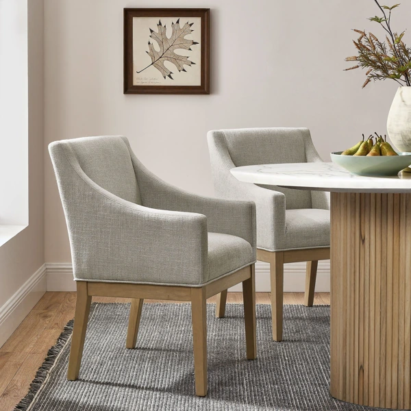 Modern grey armchairs with round fluted table