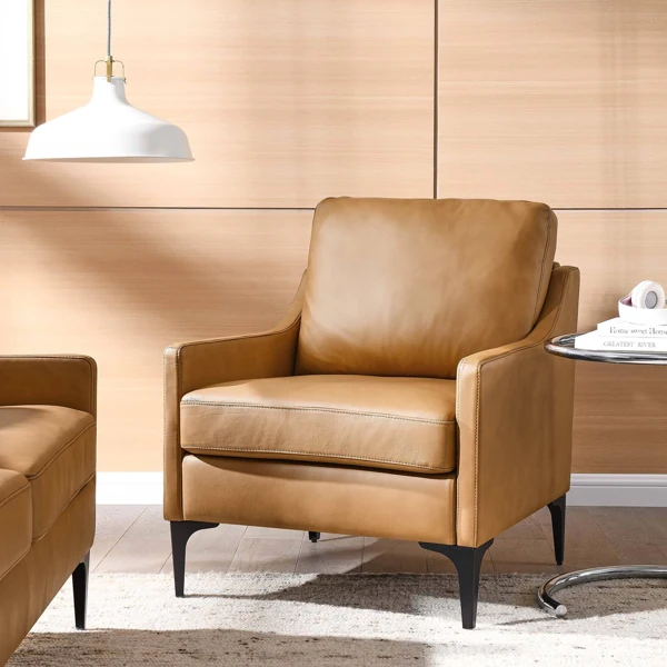 Modern tan leather armchair with black legs