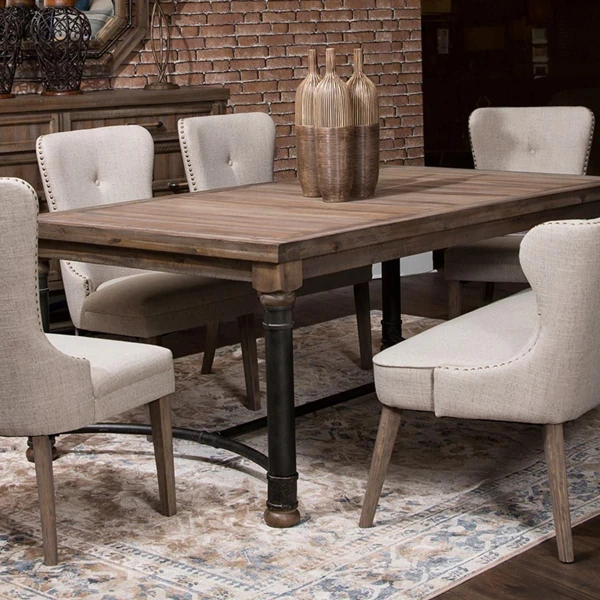 Rustic wood table with studded wingback chairs