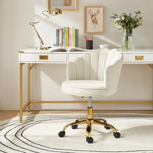 White velvet scalloped office chair with gold swivel base.